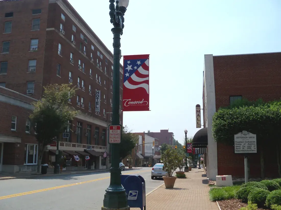 Historic brick hotel and brick sidewalks in downtown Concord, NC