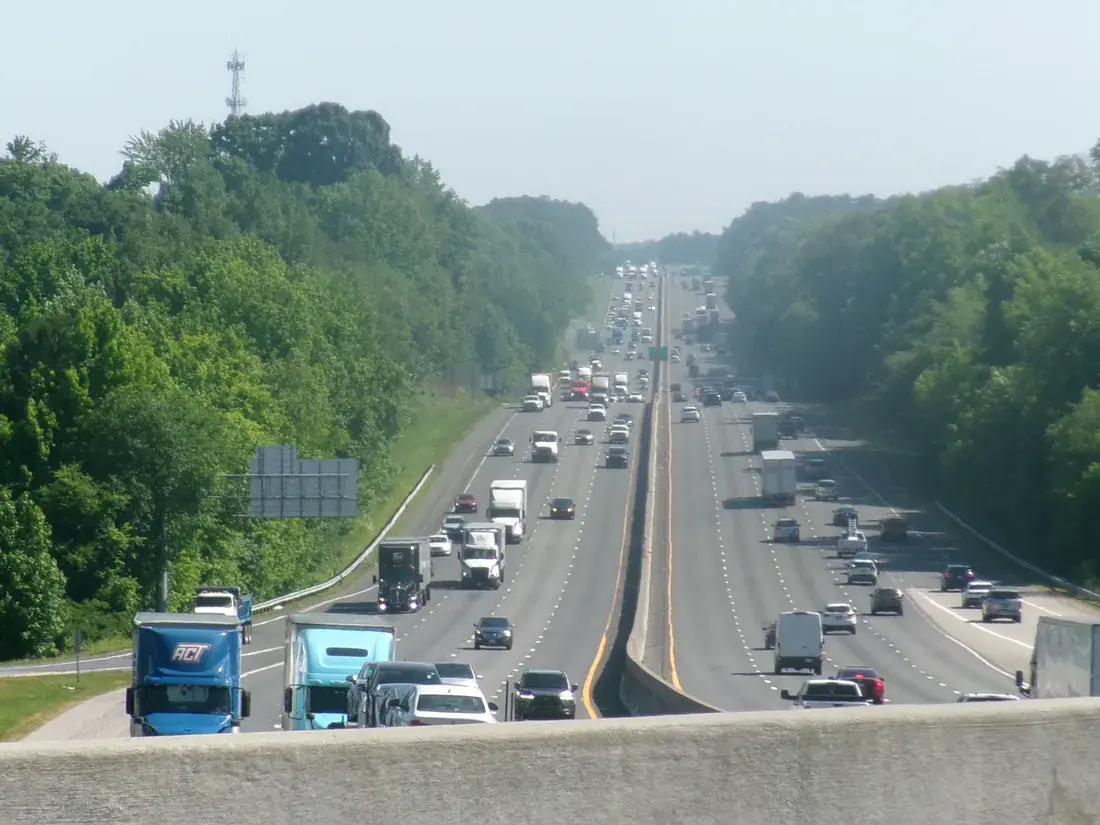 Traffic on I-77 northbound through the wooded edge of Fort Mill, SC