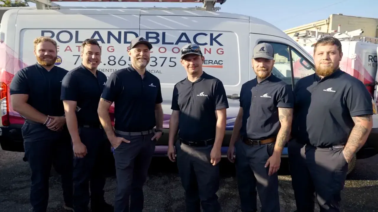 The Roland Black electrical and generator team in front of a company van in Gastonia, NC
