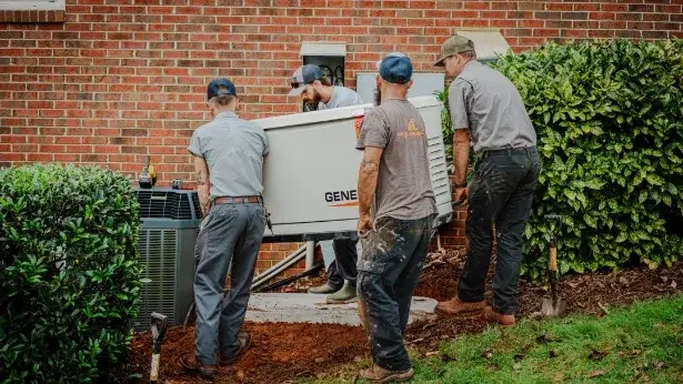 Roland Black crew servicing a Generac standby generator beside a home in Gastonia, NC