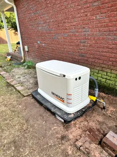 Generac standby generator installed beside a brick home in Gaston County, NC Generac standby generator installed beside a brick home in Gaston County, NC